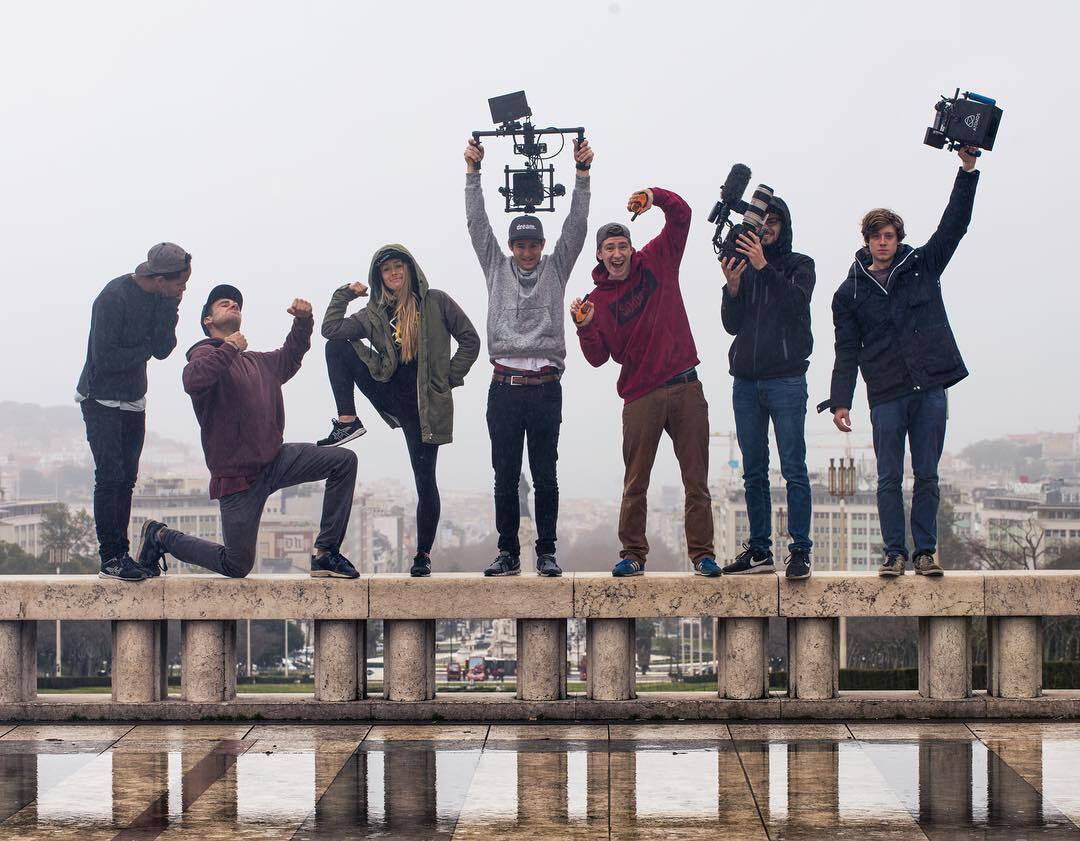 Image of the Tues team posing in front of a skyline.